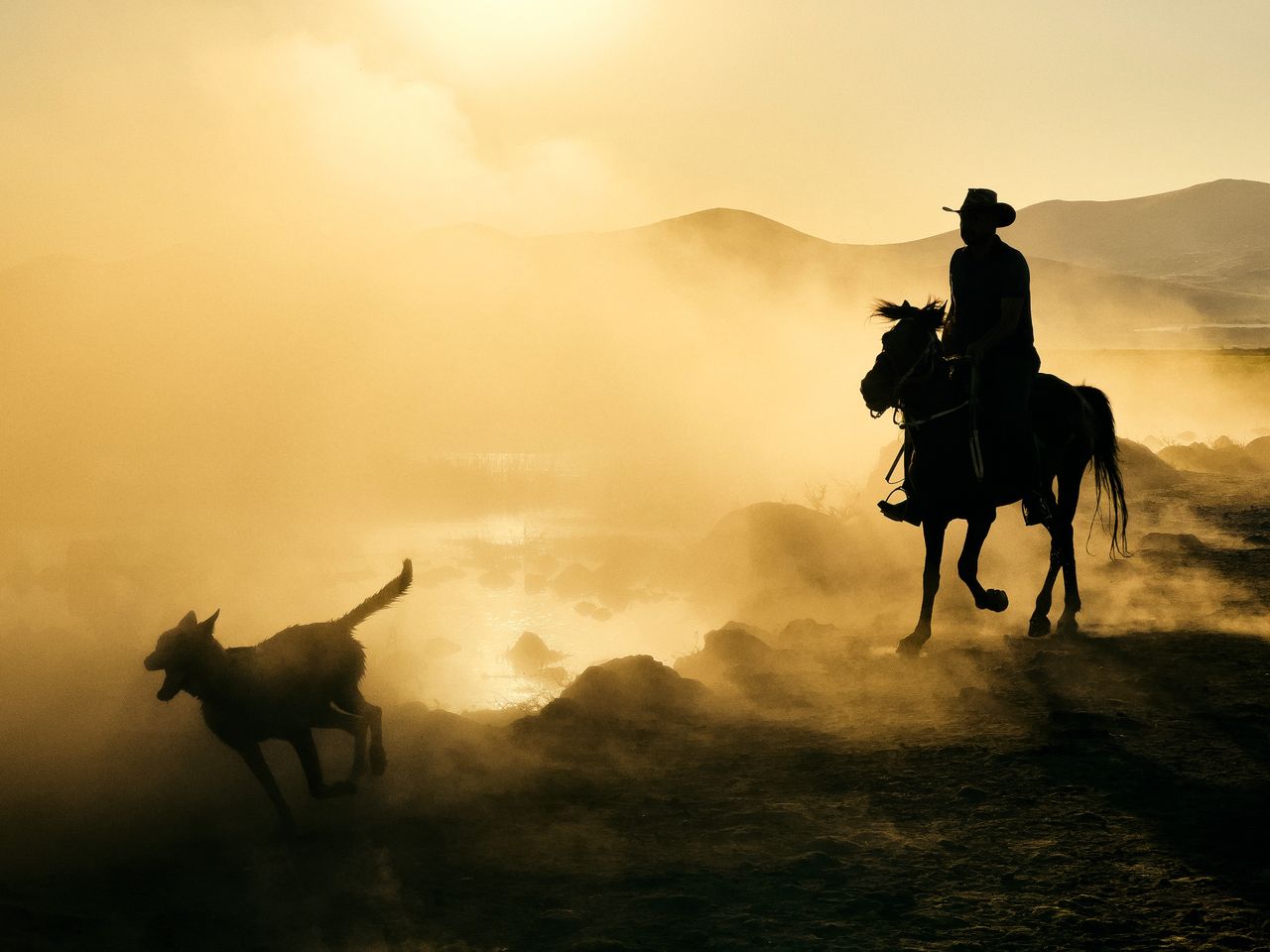 Crafting Captivating Headlines: Your awesome post title goes here Silhouette of a man on horseback with a dog in a misty, rural landscape at sunset.